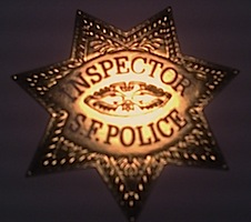 [Inspector S.F. Police badge]