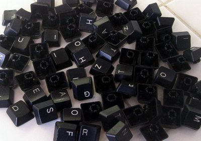 [Photo of a pile of keyboard letters]