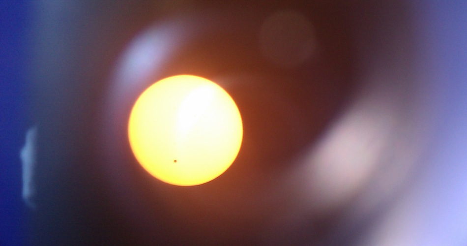 [Photo of Venus transit with cell phone.]