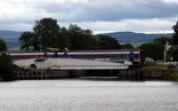 [Train crossing swing bridge]