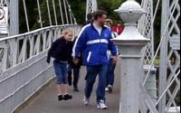 [Young girl bouncing the suspension bridge]