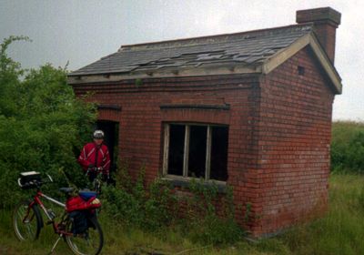 [Abandoned brick hut]